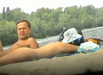 Babe With Big Natural Boobs Sunbathing At The Nudist Beach