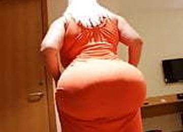 CULONZOTA EN VESTIDO NARANJA