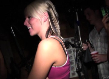 A Blonde And A Brunette Give A Blowjob At A Party In Public