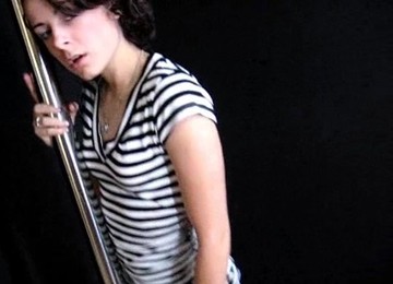 High Heeled Stripper With Long Dark Hair Touching Her Sexy Body