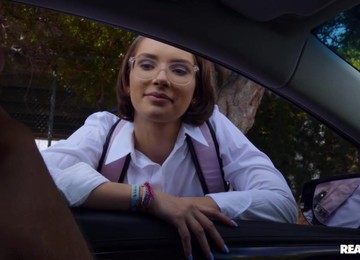 Kinky Brunette Gives Lad A Deep Blowjob Behind A Wheel