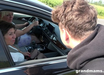 Two GILFs Offer A Young Man A Ride And Then They Fuck Him To Exhaustion