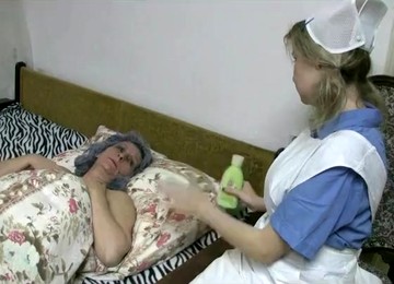 Cute Nurse In Lesbian Foreplay With Granny