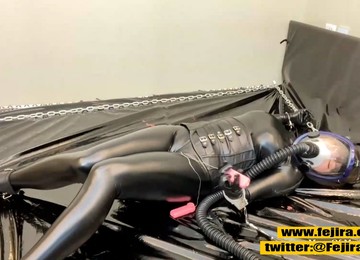 Fejira Com – Gas Mask And Shiny Leather Texture