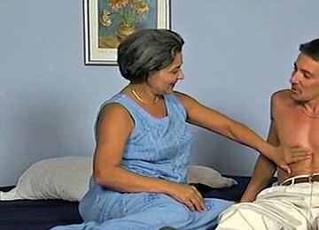 A Gray-haired Grandmother And A Young Guy