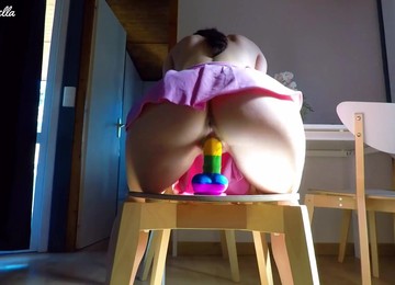 Pretty Babe In A Cute Pink Skirt Rides Her Rainbow Cock And Has An Orgasm!