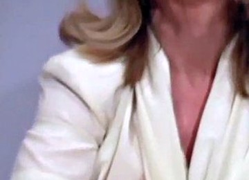 Busty Chick Exposes Shaved Slit